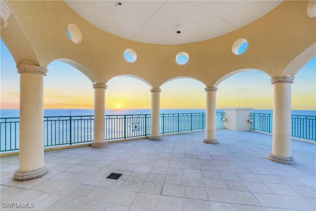 view of patio with a water view