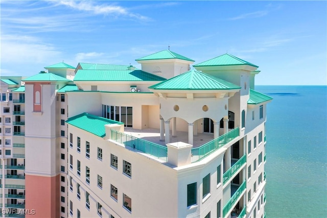 view of building exterior with a water view