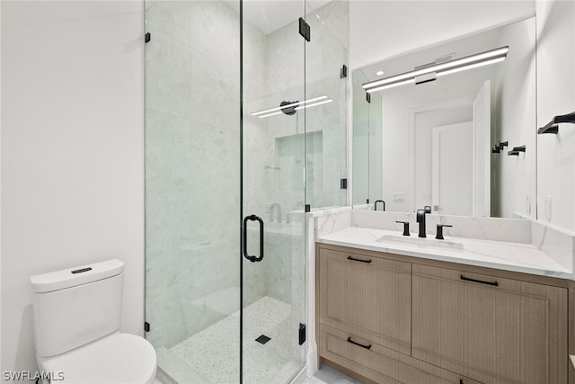 bathroom with an enclosed shower, toilet, and vanity