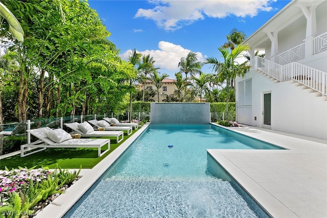 view of swimming pool with a patio