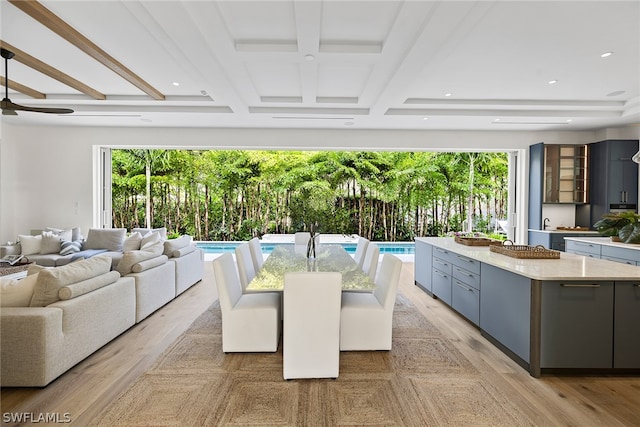 dining space featuring light hardwood / wood-style flooring and ceiling fan