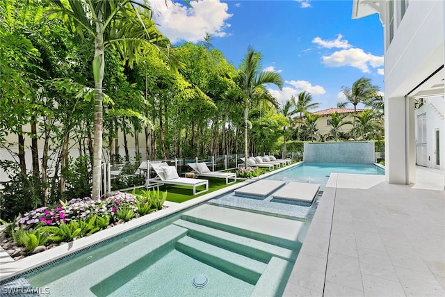 view of swimming pool with a patio area