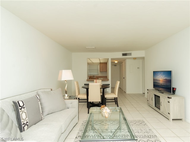 living room with light tile patterned floors