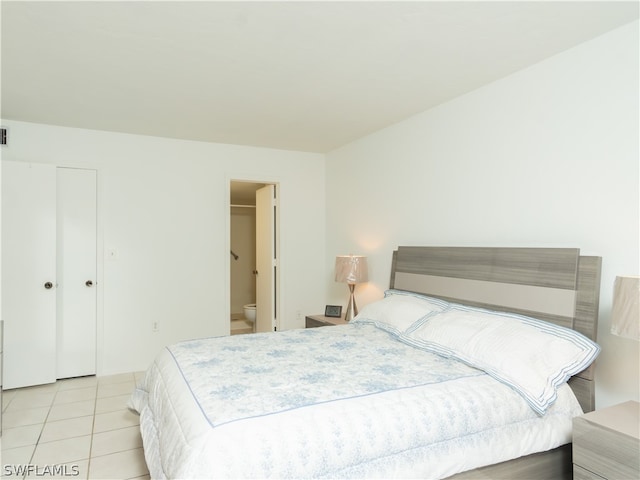 tiled bedroom with ensuite bath