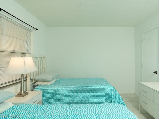 bedroom featuring light tile patterned floors