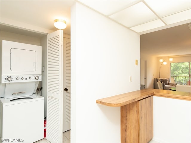 washroom with stacked washer / drying machine