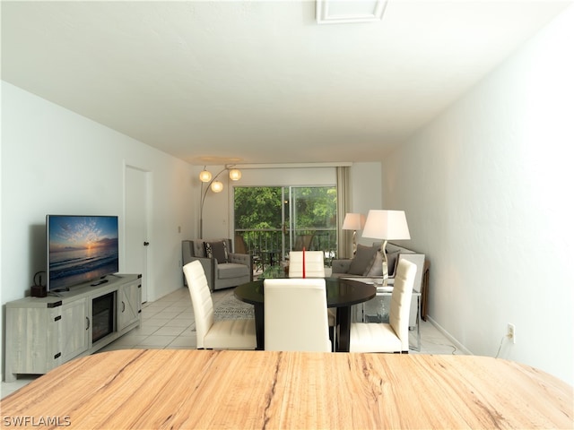 dining space with light tile patterned flooring