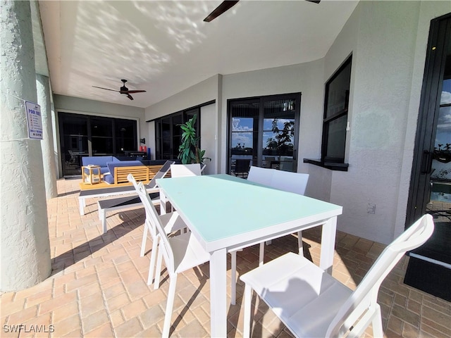 view of patio with ceiling fan and an outdoor hangout area