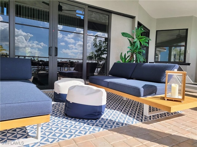 view of patio featuring an outdoor living space and french doors