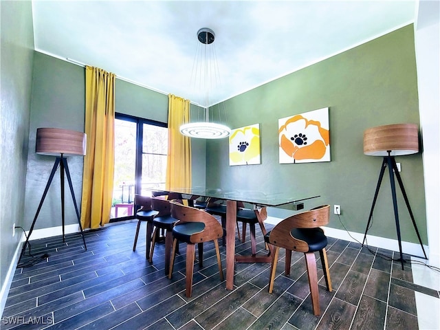 dining space featuring dark hardwood / wood-style flooring