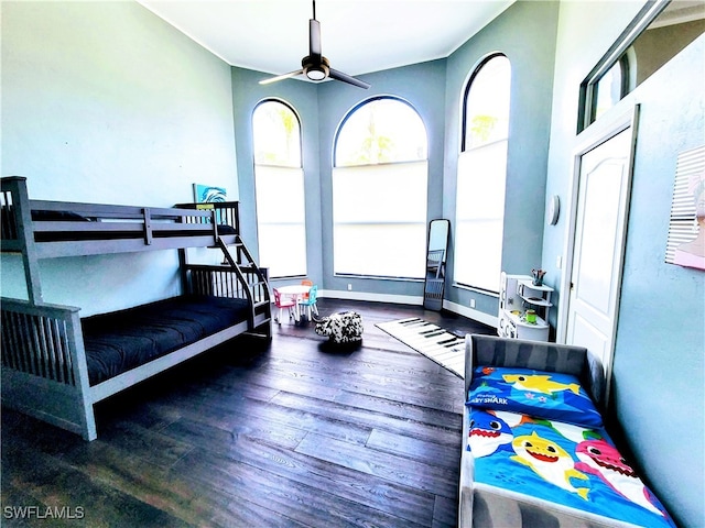 bedroom featuring dark wood-type flooring and ceiling fan