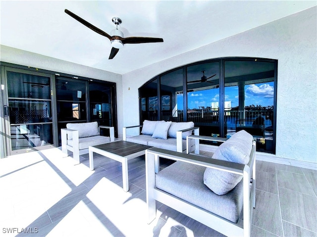 view of patio / terrace with ceiling fan and an outdoor hangout area