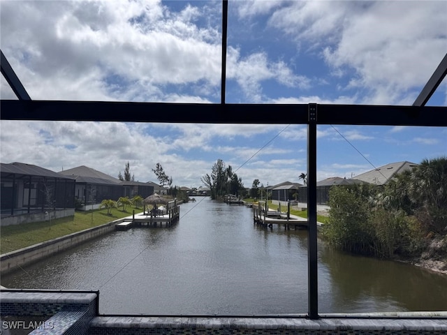 property view of water featuring a dock and a residential view