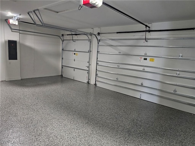 garage with electric panel and a garage door opener