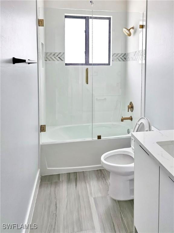 bathroom featuring vanity,  shower combination, and toilet