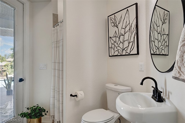 bathroom with toilet and sink