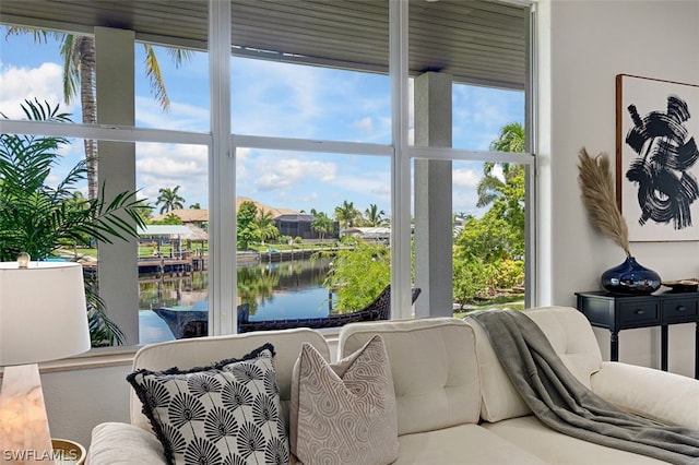 interior space featuring hardwood / wood-style floors, a water view, and a wealth of natural light