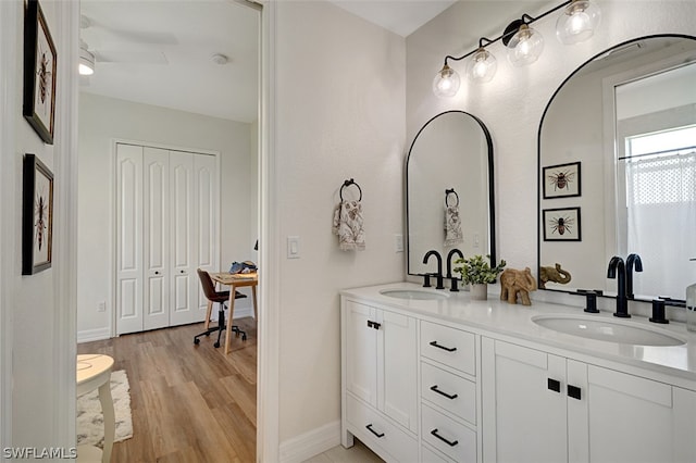 bathroom featuring vanity and hardwood / wood-style flooring