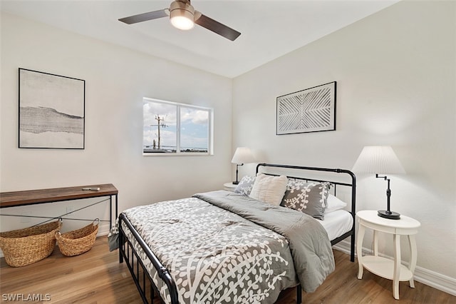 bedroom featuring ceiling fan and wood-type flooring