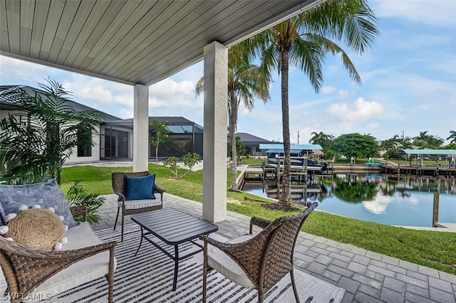 view of patio / terrace with a dock, a water view, and glass enclosure