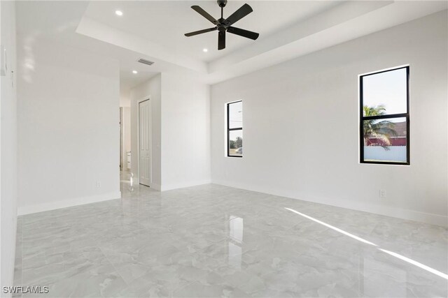 302 El Dorado Blvd N, Cape Coral, FL 33993 - spare room featuring a tray ceiling, visible vents, ceiling fan, and a wealth of natural light
