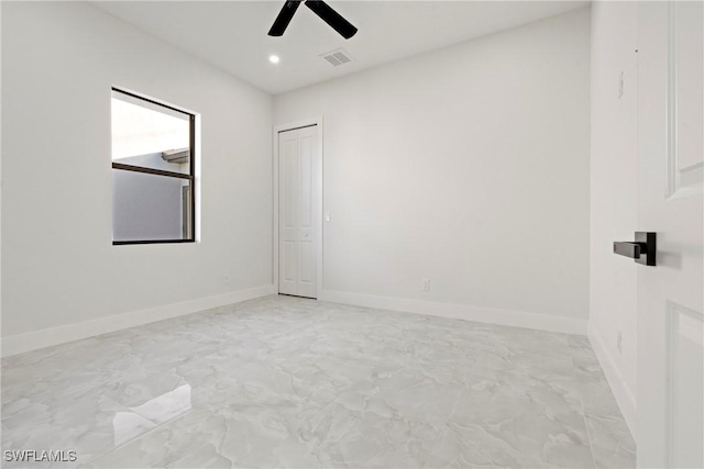 empty room featuring baseboards, visible vents, a ceiling fan, and recessed lighting