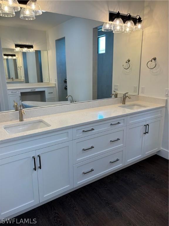 bathroom with vanity and wood-type flooring