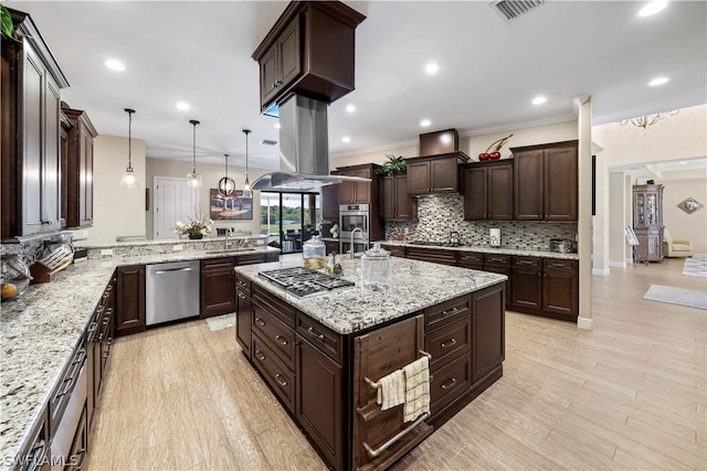 kitchen featuring tasteful backsplash, dark brown cabinets, appliances with stainless steel finishes, and crown molding