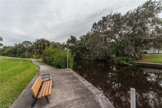 view of nearby features featuring a water view and a lawn