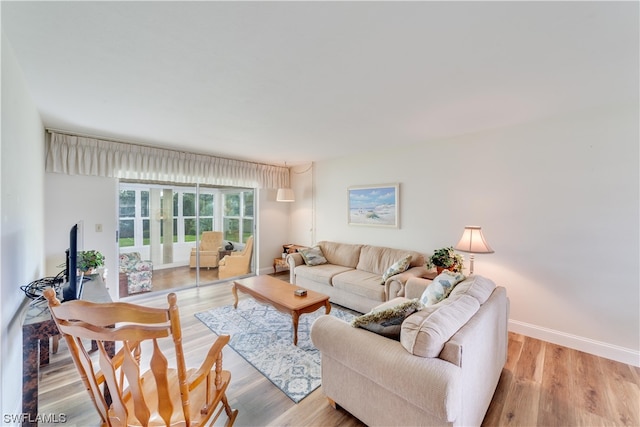 living room with light hardwood / wood-style floors