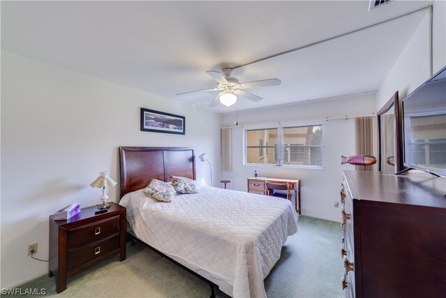 bedroom with light carpet and ceiling fan