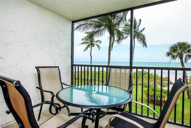 balcony featuring a water view