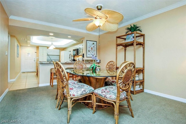 dining space featuring light tile floors, ornamental molding, and ceiling fan