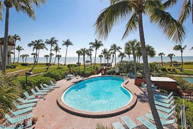 view of swimming pool with a water view