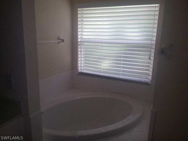 bathroom featuring a washtub