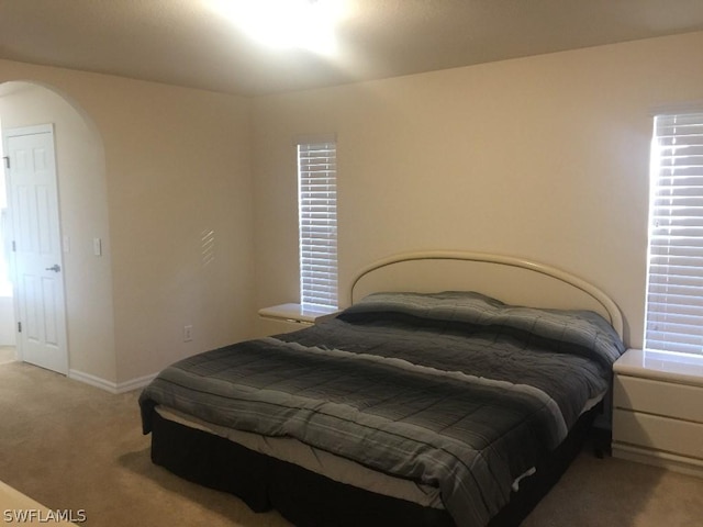 bedroom with dark carpet