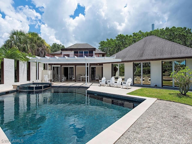 view of pool featuring an in ground hot tub and a patio