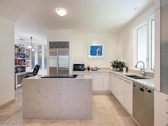 kitchen featuring white cabinets, appliances with stainless steel finishes, sink, and light tile flooring