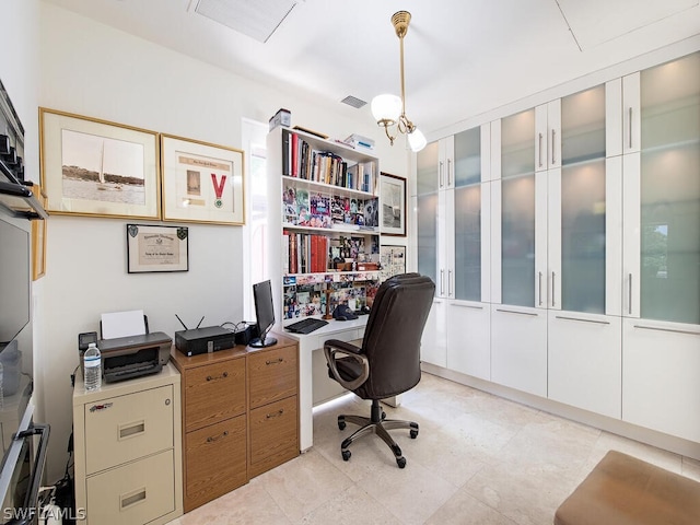 tiled office with a chandelier