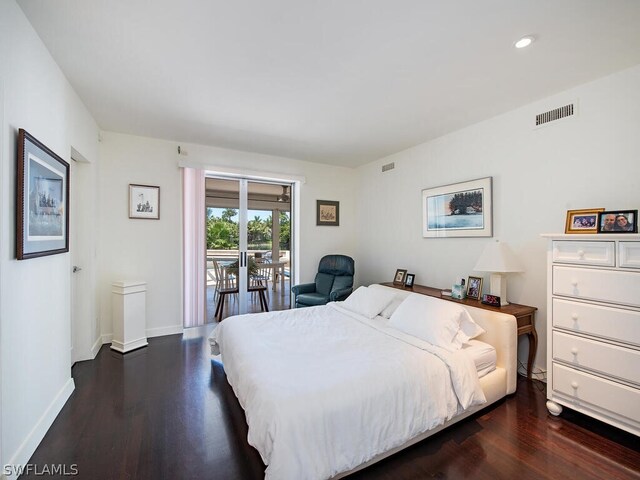 bedroom featuring access to outside and dark hardwood / wood-style flooring