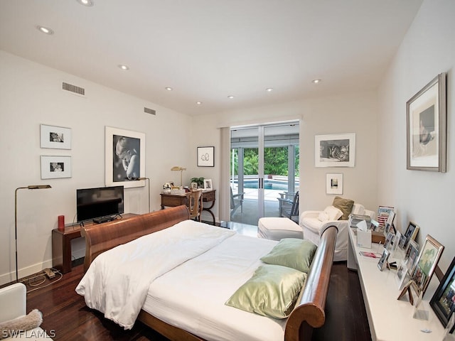 bedroom featuring dark hardwood / wood-style floors and access to exterior