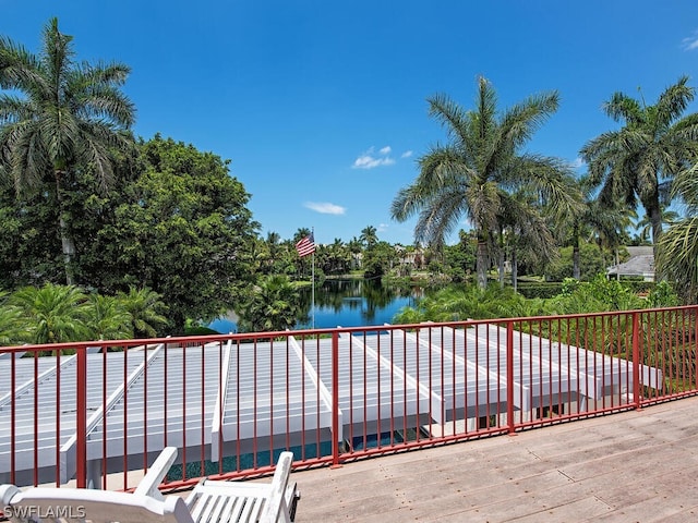 view of patio / terrace with a water view and a balcony