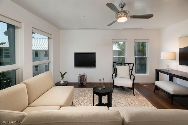 living room featuring ceiling fan and hardwood / wood-style flooring