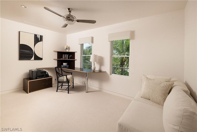 office with carpet floors and ceiling fan