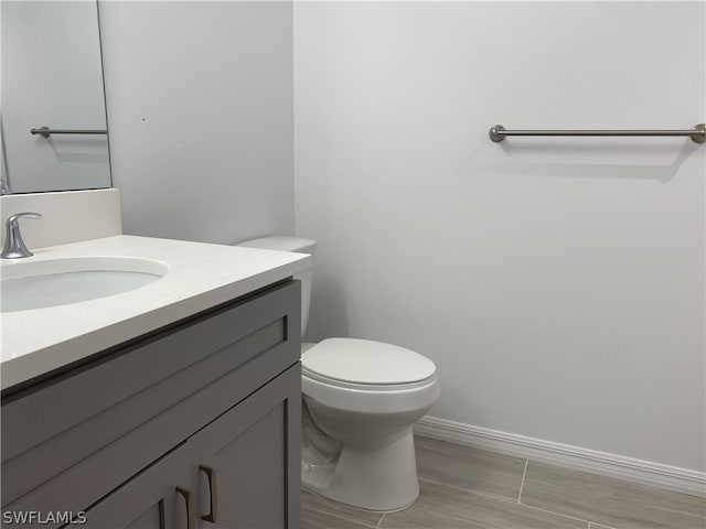 bathroom with oversized vanity and toilet