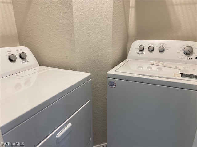 washroom with independent washer and dryer