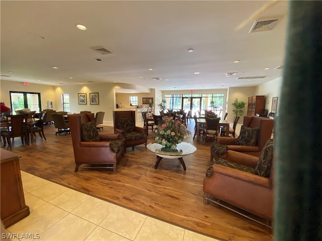 living room featuring light tile flooring and a wealth of natural light