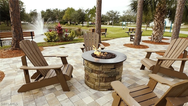 exterior space with a fire pit, a yard, and a patio area