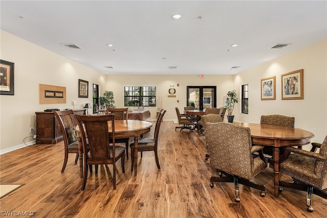 dining area with light hardwood / wood-style flooring