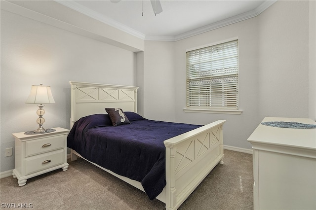 carpeted bedroom featuring crown molding and ceiling fan